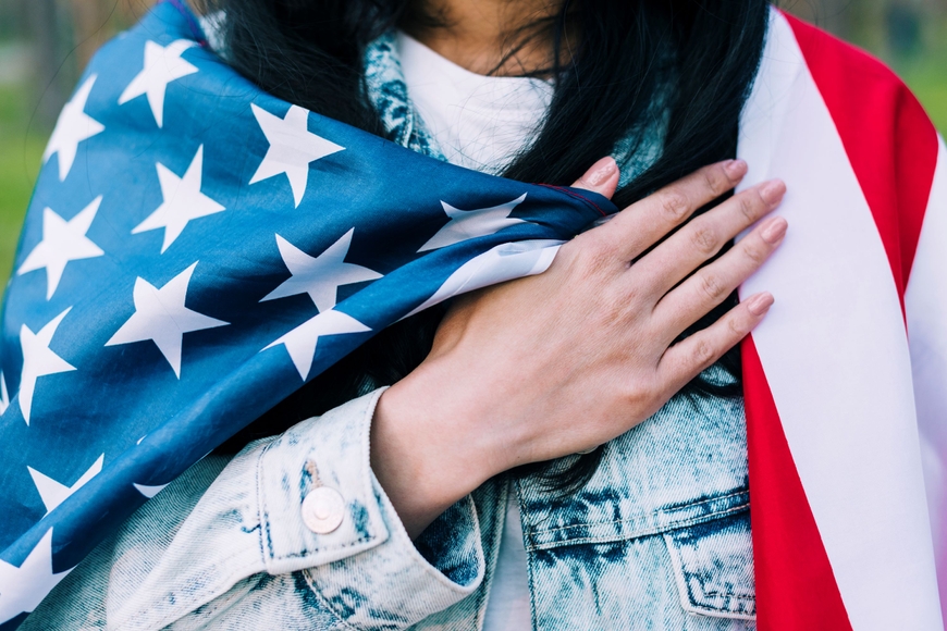 Woman with American flag on her shoulders
